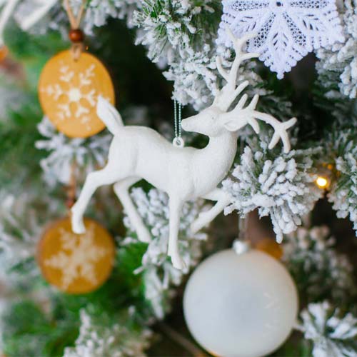 White stag hung on Christmas tree